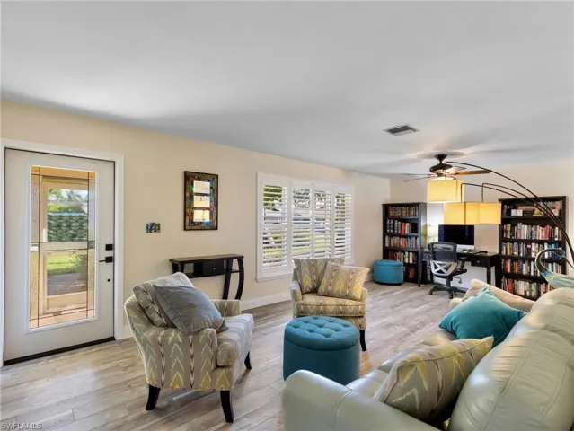 Updated LVP flooring, plantation shutters in the living room