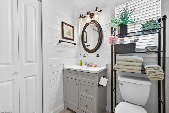 Cottage bath has a closet and a window for natural light