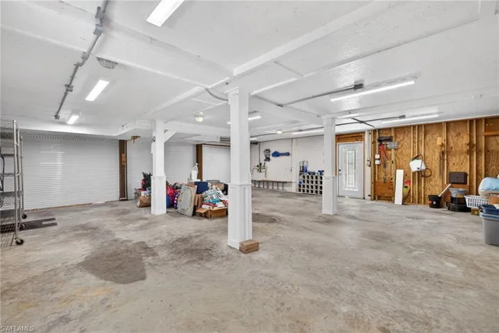 Huge Garage has lots of lighting, outlets, and a separate AC system than the workshop.