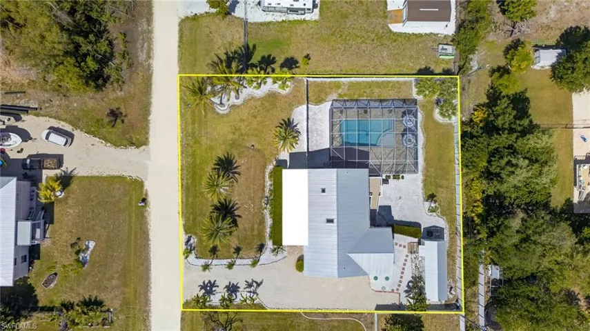 Direct overhead view showcases metal roof and HUGE pool/pool deck