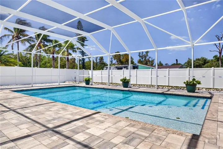 Pool deck is placed to get sun all day and features the views and sounds of coconut palms.