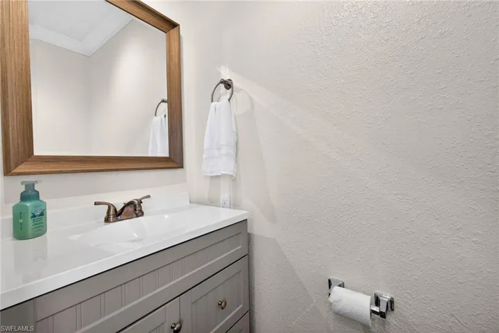 Half bath behind the kitchen serves guests that aren't spending the night