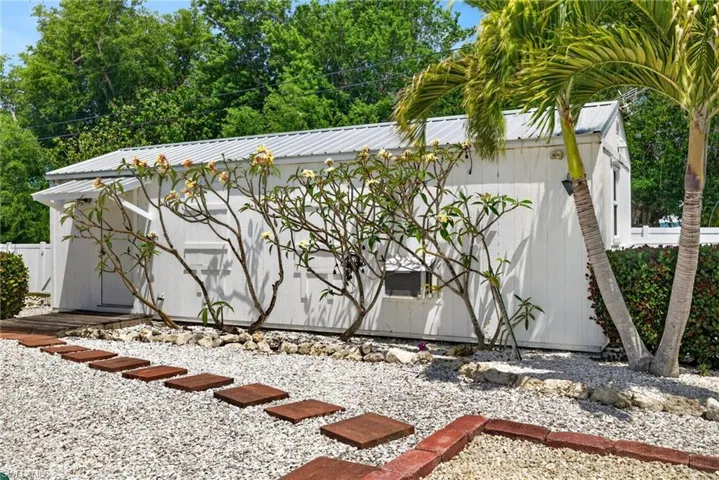 Detached cottage in the back yard has a private entrance, its own parking, and its own meter