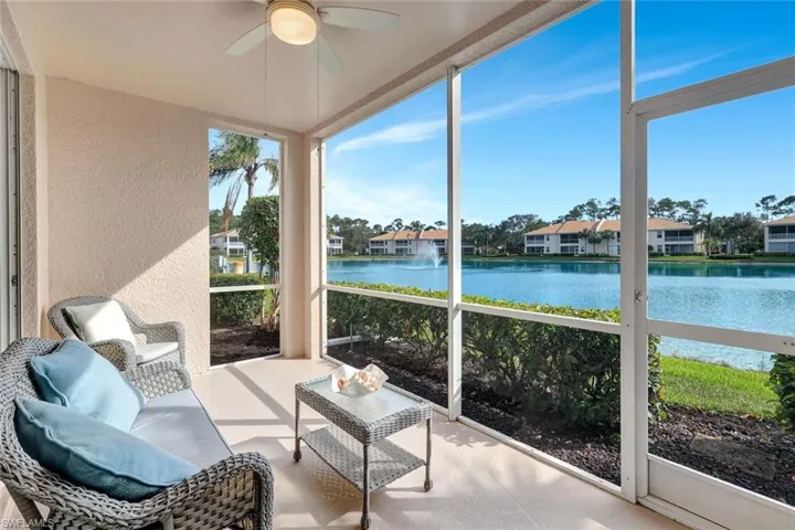 Sunroom lanai with western water/fountain  views, backyard and ceiling fan!