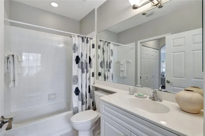 Guest/powder bathroom has linen closet.