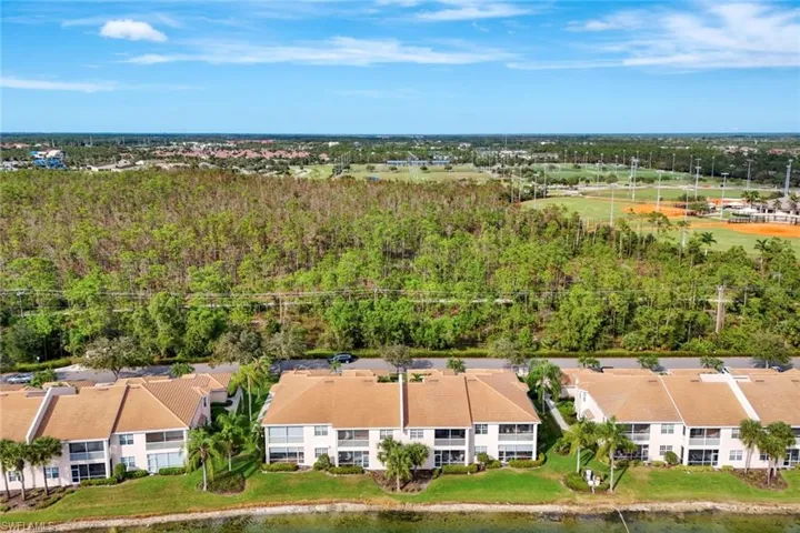 Aerial view with wooded trails and N Collier Regional Park in background!