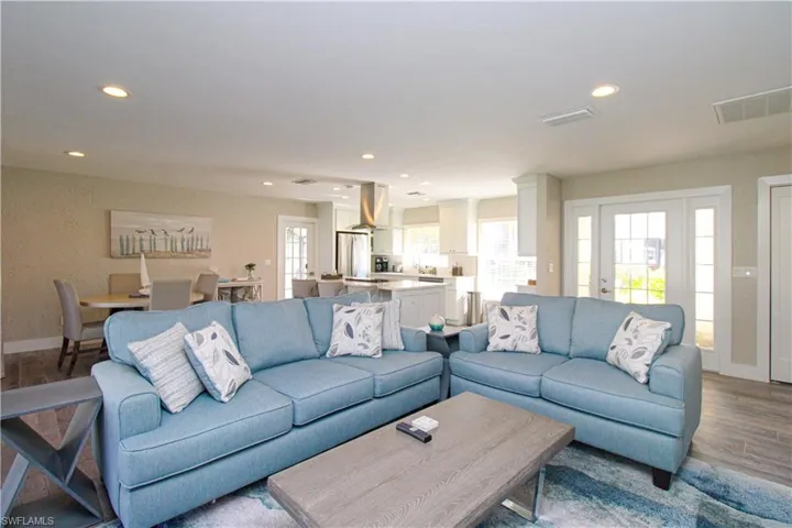 Living room with light hardwood / wood-style flooring