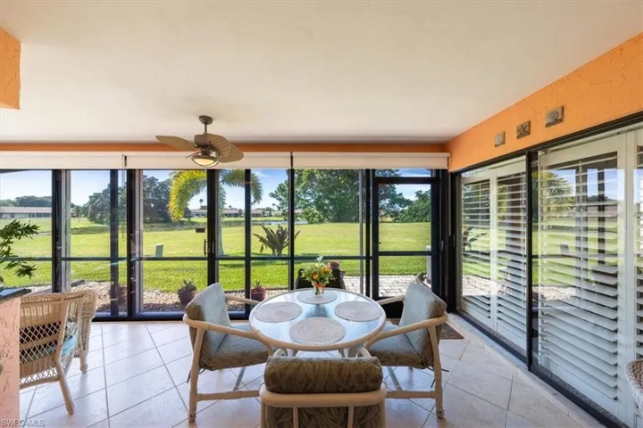 Sunroom / solarium featuring ceiling fan
