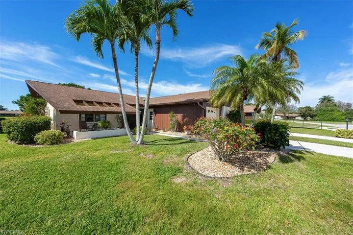 View of front of property featuring a front lawn