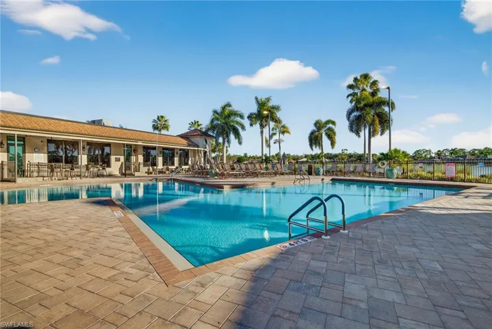 Community pool featuring a patio