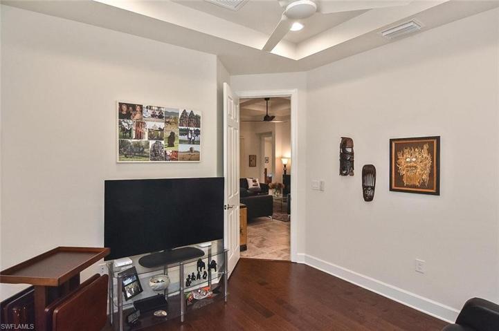 The Den/ Office has wood flooring and is located just off of the Great Room
