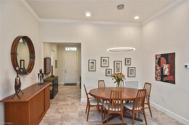 The Dining Area is adjacent to the Living Area of this wonderful home.