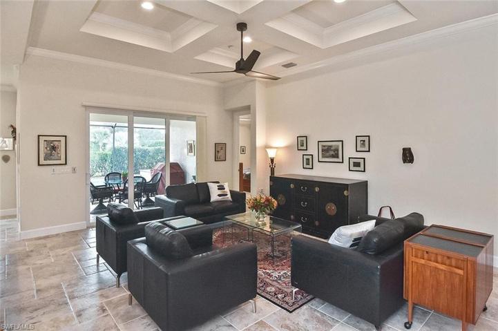 The spacious Living space in the Great Room overlooks the Lanai, pool, and spa.