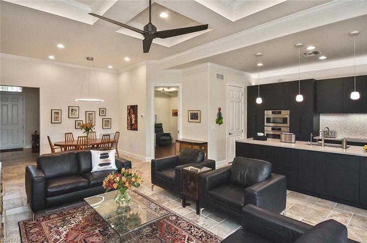 The Great Room with tile flooring, upgraded lighting and a brilliant open design