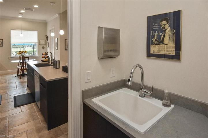 Laundry Room with sink is located just off of the Kitchen