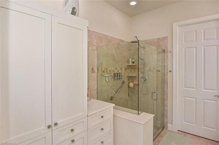 Primary Ensuite' with custom cabinetry and storage.