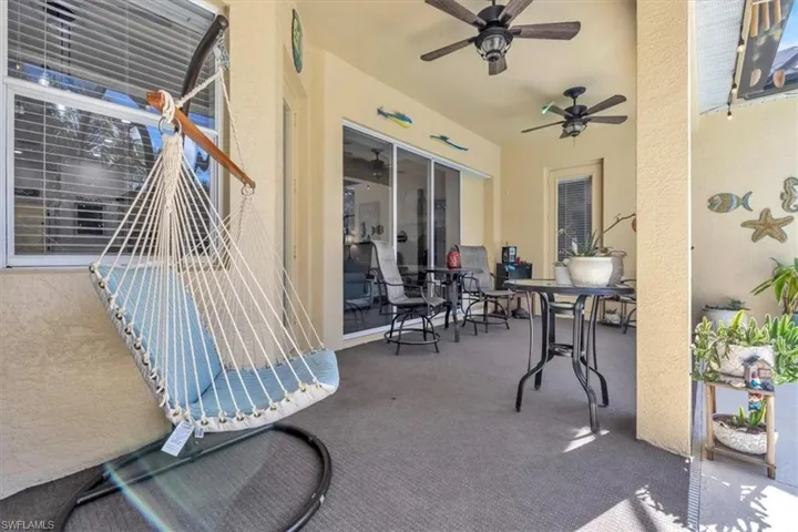 View of patio featuring outdoor dining space and ceiling fan
