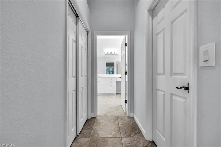 Hall featuring a textured wall