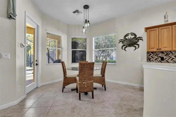 Dining room featuring plenty of natural light and light tile patterned floors
