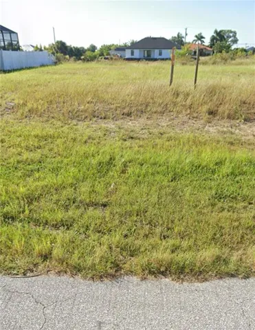 View of yard with a rural view
