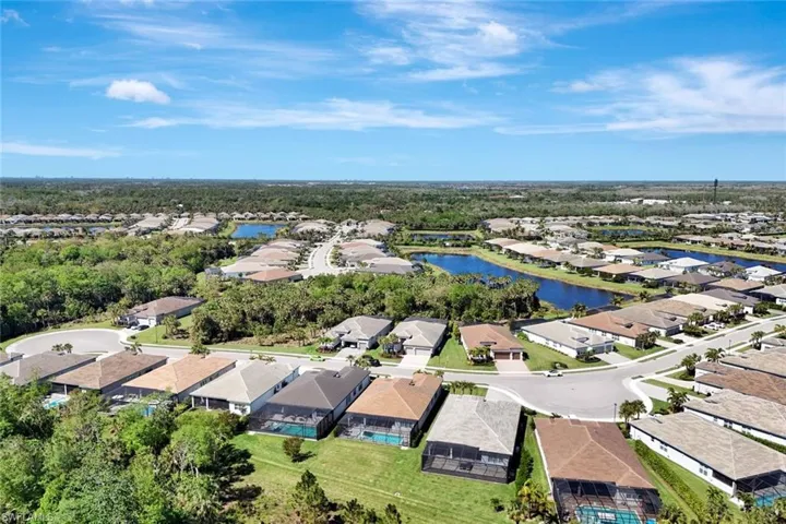 Aerial view featuring a residential view and a water view
