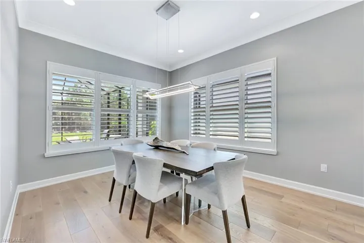 Dining space with recessed lighting, light wood-type flooring, baseboards, and ornamental molding