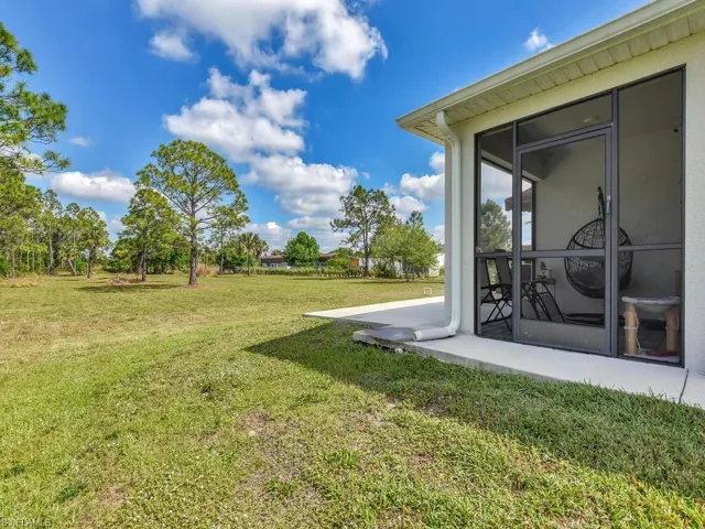 View of yard with a sunroom