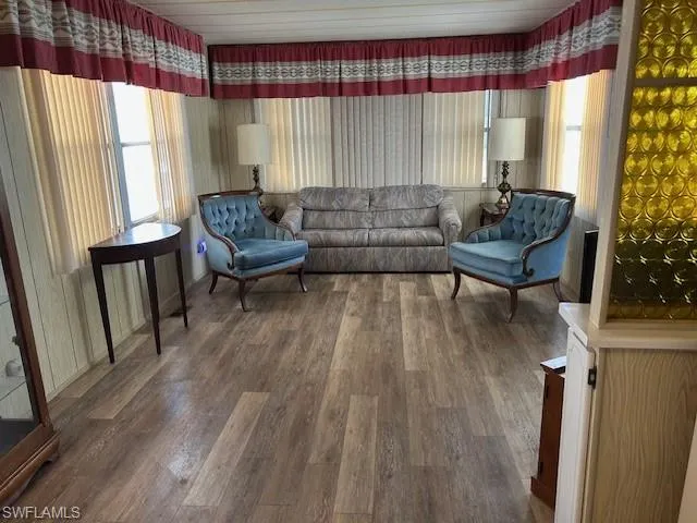 Living room featuring healthy amount of natural light and wood finished floors
