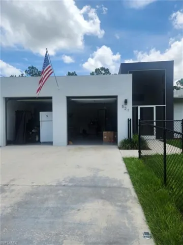 Garage featuring freestanding refrigerator