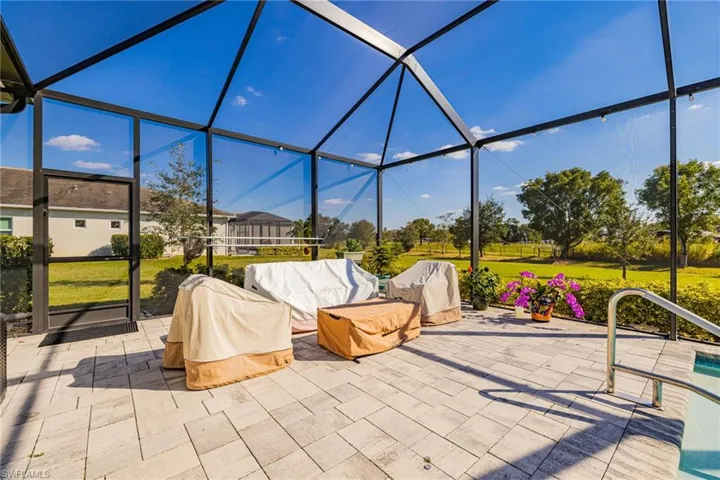 View of patio / terrace featuring glass enclosure and a sunroom
