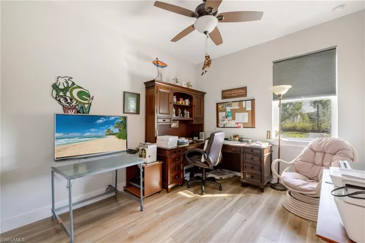 Office area featuring light wood-type flooring and ceiling fan