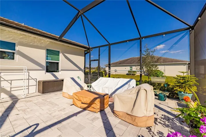 View of patio / terrace featuring a sunroom and a lanai