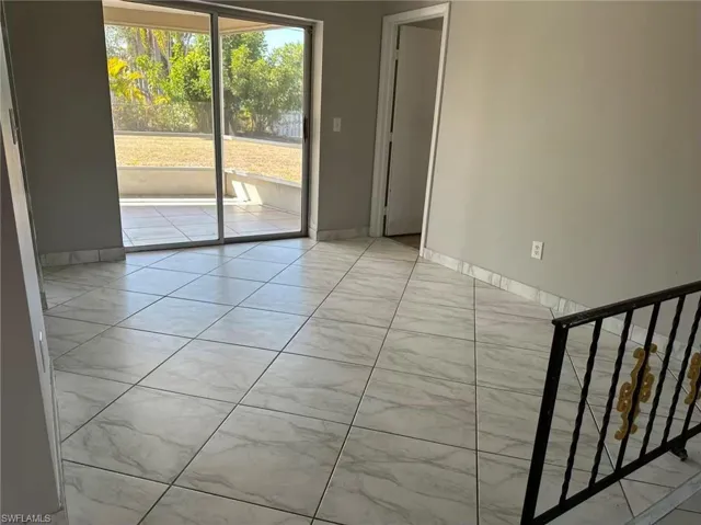 Empty room featuring baseboards