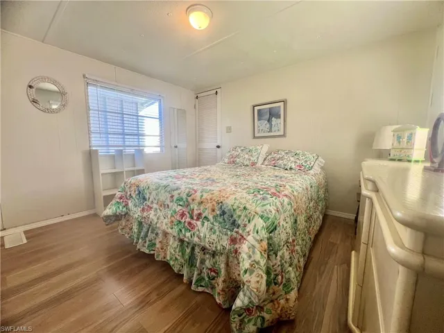 Bedroom with hardwood / wood-style floors