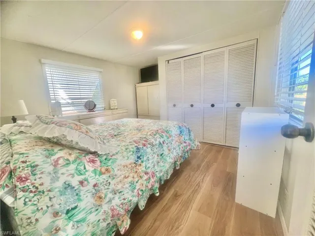 Bedroom featuring a closet and light hardwood / wood-style flooring