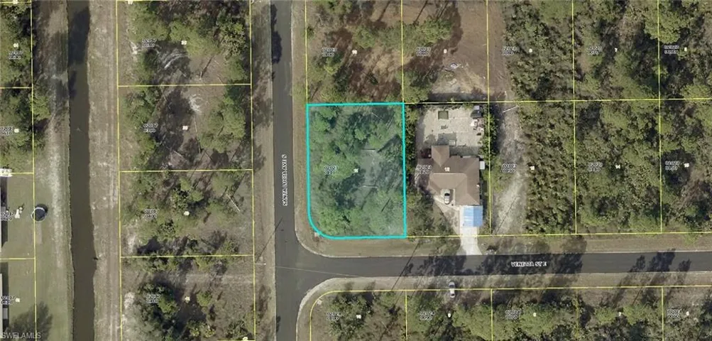 Aerial map of property and surrounding area featuring property boundaries highlighted