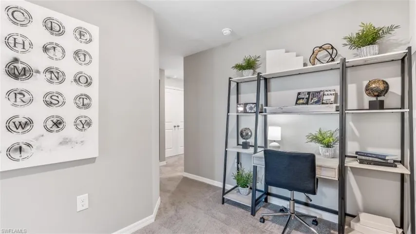 Office area featuring light colored carpet