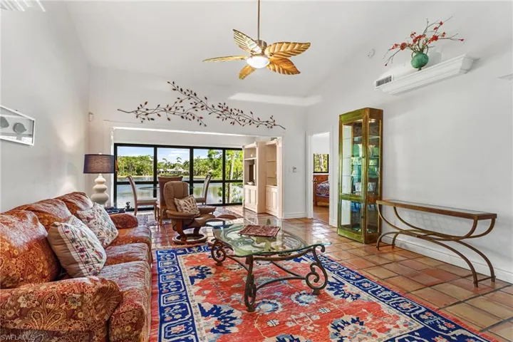 Living area has vaulted ceiling, skylights, ceiling fan and so much room!