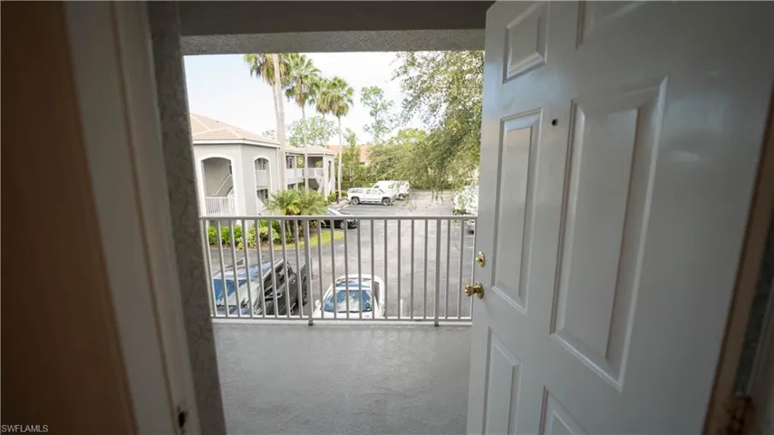 Doorway featuring carpet flooring