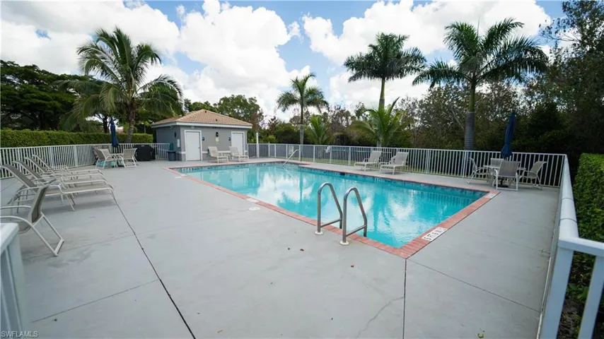 Community pool with a patio area