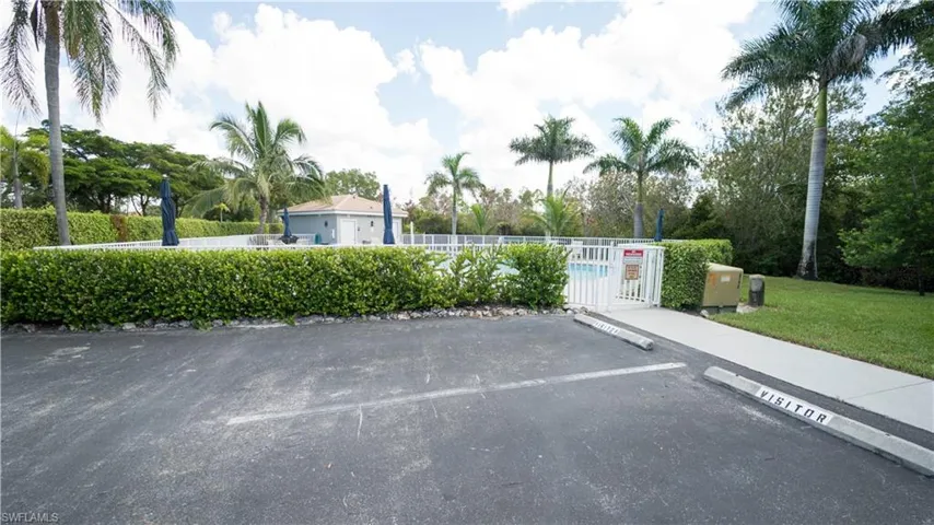 Uncovered parking lot featuring a gate