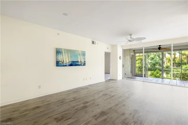 Living room with new LTV flooring and ceiling fan