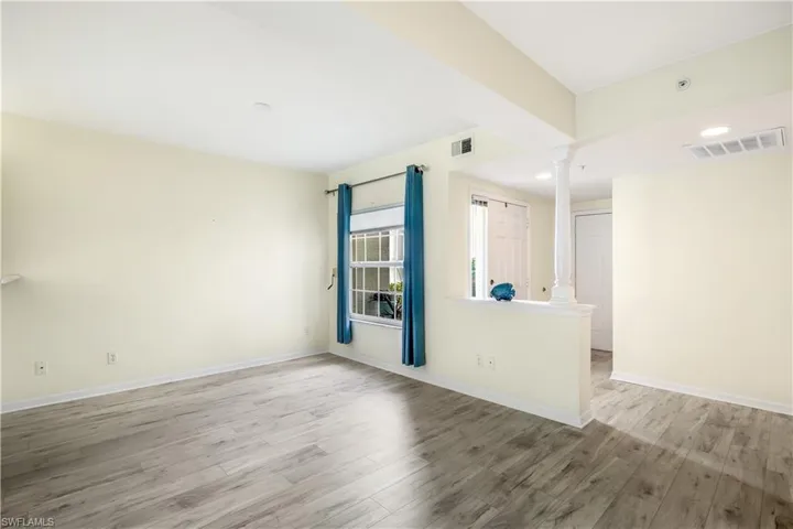 Dining/Den/Bonus area with decorative columns and new LTV flooring