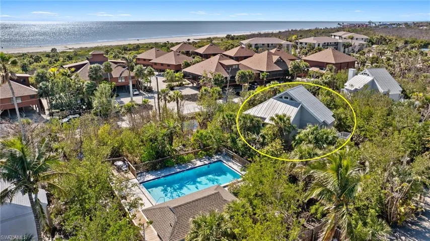Aerial view with a beach view and a water view