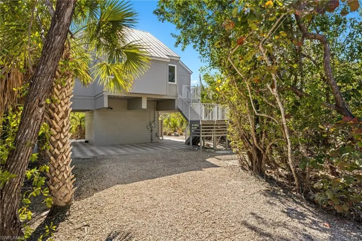 View of side of home featuring a garage