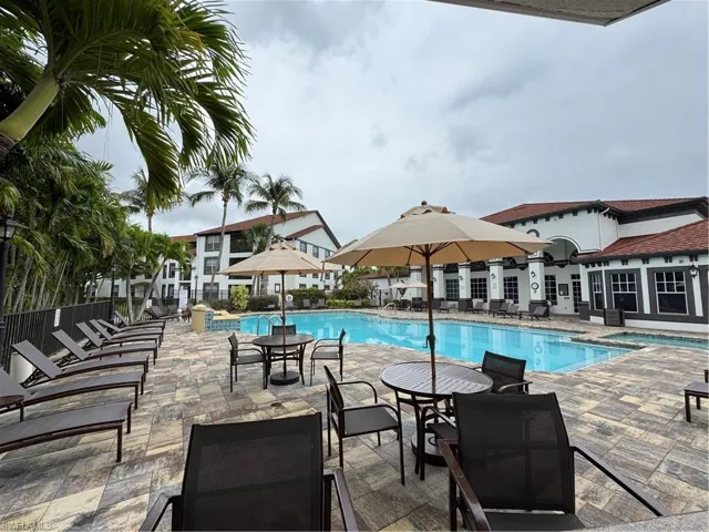 Community pool featuring a patio