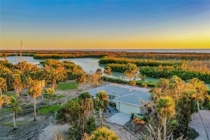 Aerial view at dusk with a water view