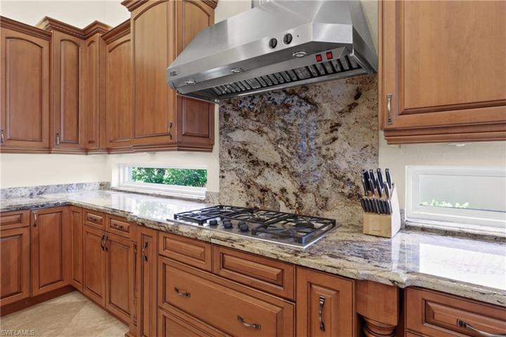 Gas cooking counter top range in kitchen.