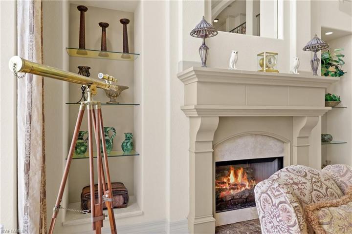 Granite Fireplace in living room with gas logs.