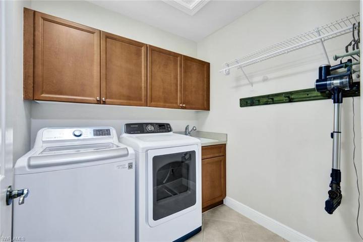 Large laundry room with PLENTY of storage.